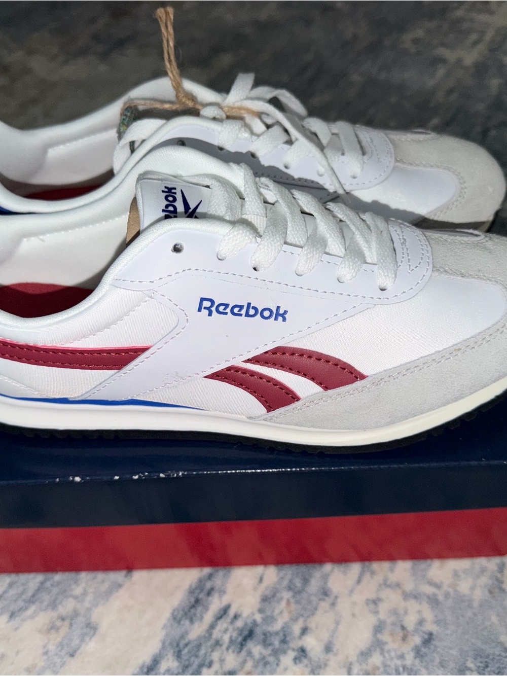 Reebok Women's White Sneakers with Blue and Red Accents